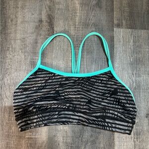 Lululemon Flow Y bra in a black and white striped pattern with a teal trim
